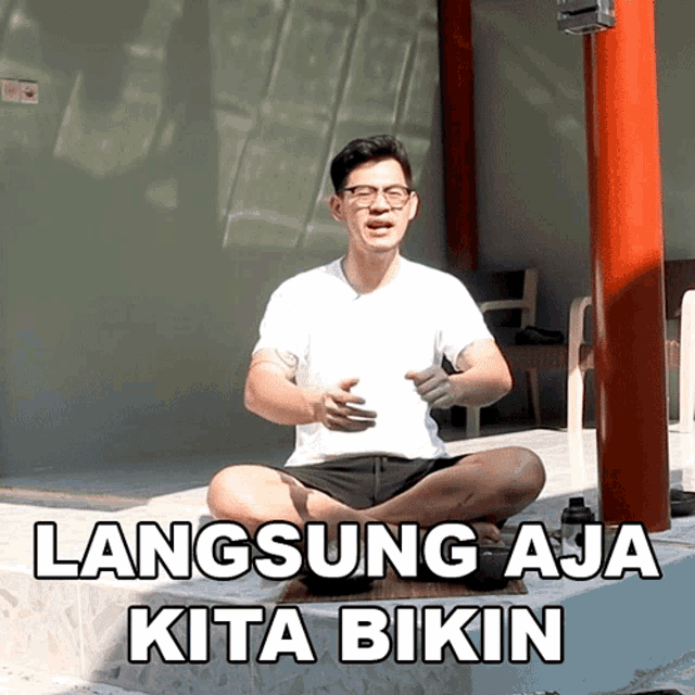 a man sits in a lotus position with the words " langsung aja kita bikin " below him