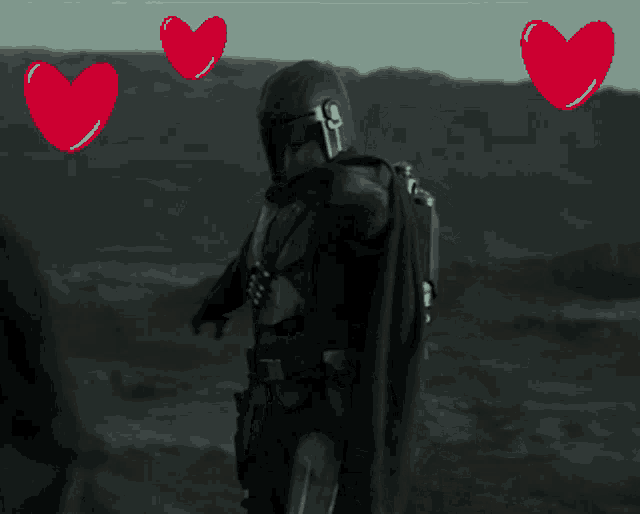 a man with his arms outstretched is surrounded by hearts