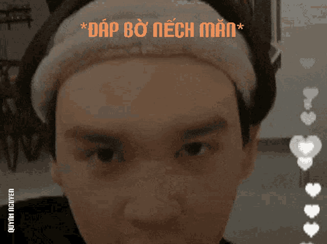 a close up of a man 's face with hearts around it and the words " dap bo nech man " above him