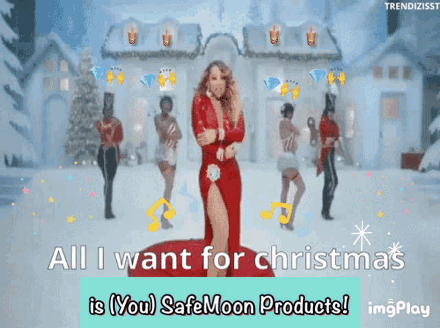 a woman in a red dress is dancing in front of a snowy house with the words all i want for christmas