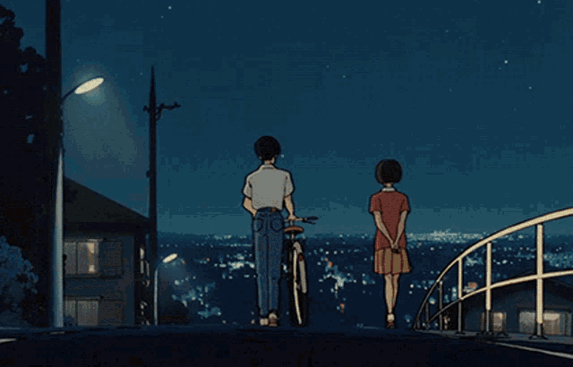 a man and a woman standing next to each other with a bicycle in the background