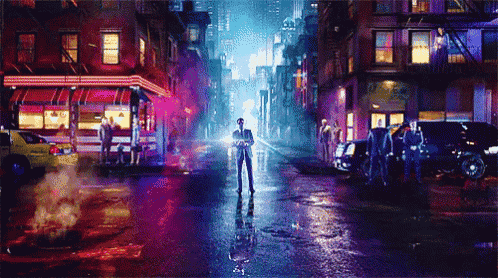a man in a suit is standing in the middle of a city street at night