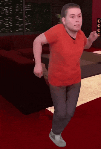 a man in a red shirt is running with a fidget spinner