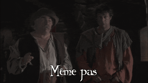 two men standing next to each other with memepas written on the bottom