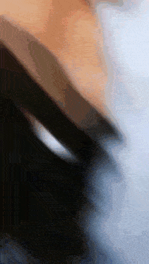 a blurred image of a person 's face with a few lines