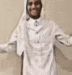 a blurry picture of a person 's face against a beige wall .