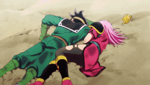 a man and a woman are laying on the ground