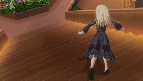 a girl in a plaid dress is walking down a set of stairs