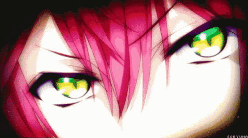 a close up of a person 's eyes with green and yellow eyes