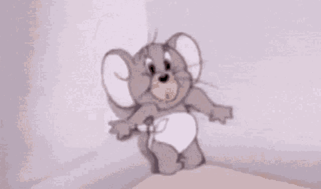 a cartoon mouse in a diaper is sitting on a bed .