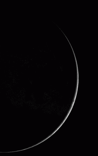 a black and white photo of the earth with clouds on it