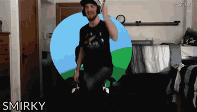 a man wearing headphones and a black shirt with the word smirky on it