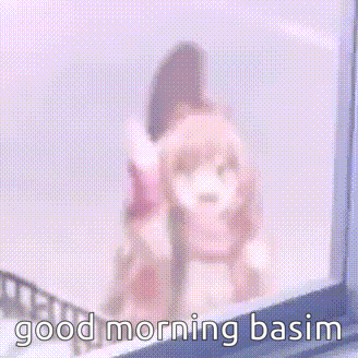 a girl in a scarf is standing on a balcony waving her hand and the words `` good morning basim '' .