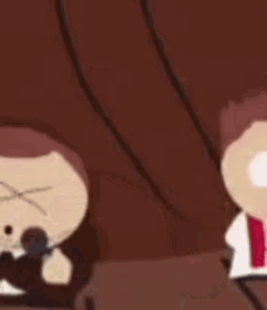 a couple of cartoon characters sitting next to each other on a couch .