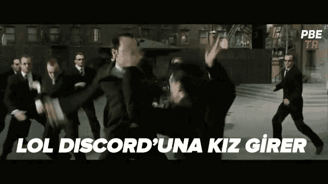 a group of men in suits are dancing in front of a building with the words lol discorduna kiz girer in the corner