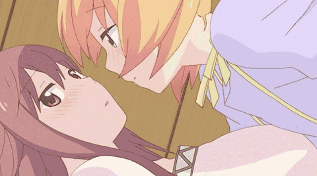 a couple of anime characters are looking at each other and one of them has a purple shirt on