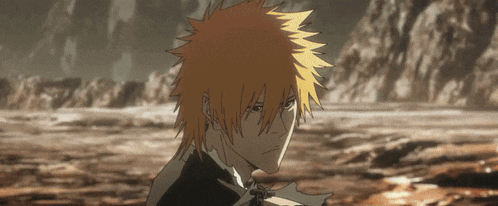 a man with orange hair is standing in a field