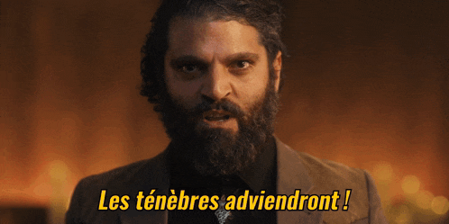 a man with a beard and the words les tenebres adviendront