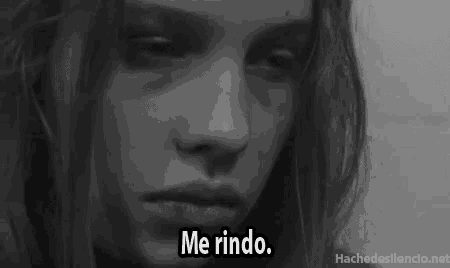 a black and white photo of a woman 's face with the words me rindo on the bottom
