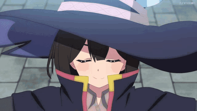 a girl wearing a witch hat is smiling in front of a screen that says funimation on it