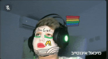 a person wearing headphones and a mask that says ' i 'm gay ' on it
