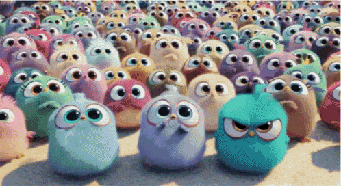 a bunch of cartoon birds with big eyes are standing in a line