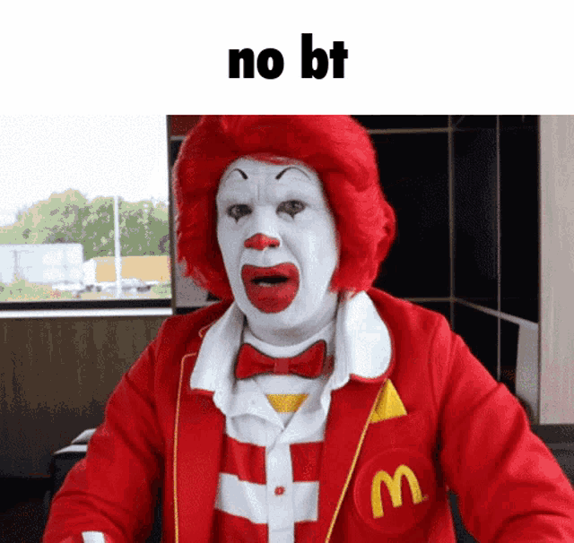 a mcdonald 's clown with red hair and white face says no bt