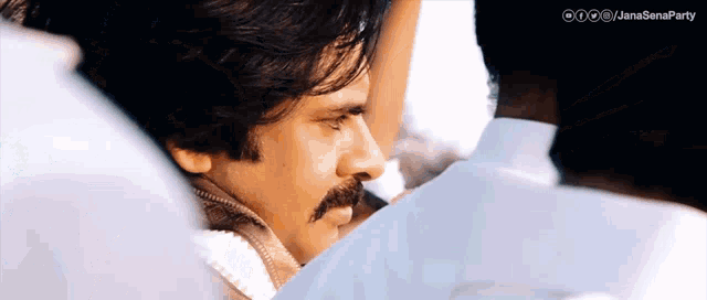 a close up of a man 's face with the words janasenaparty written on the bottom