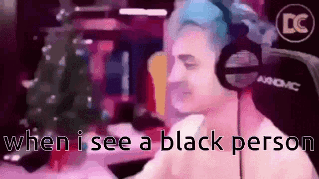 a man wearing headphones with the words " when i see a black person " on the bottom