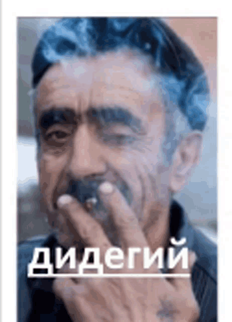 a man with a mustache is smoking a cigarette and covering his mouth .