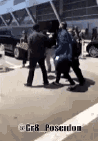a group of people are walking down a street with the hashtag gr8 poseidon in the corner