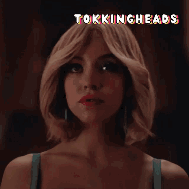 a woman 's face is shown with the words " tokingheads " above her