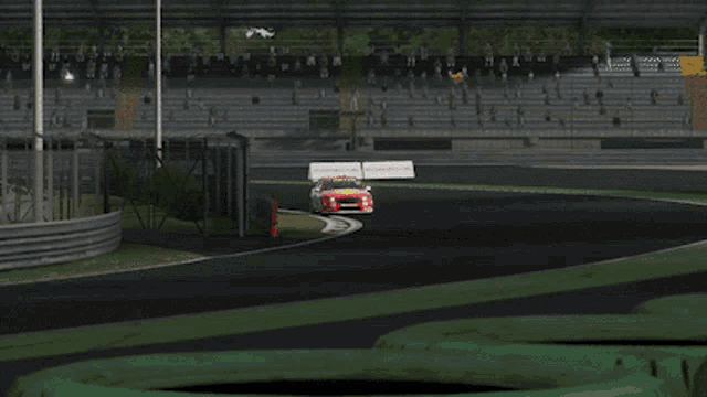 a red and yellow race car with shell v-power written on it