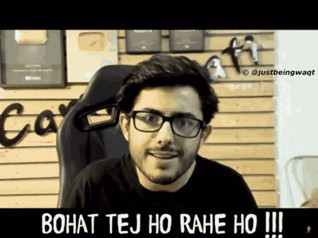 a man wearing glasses and a black shirt with the caption bohat tej ho rahe ho
