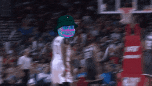 a basketball player wearing a green hat and a mask with a smiley face on it