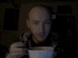 a bald man is eating something from a bowl
