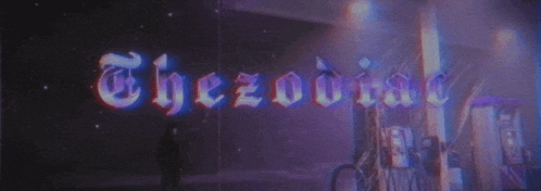 a sign that says the zodiac on it in purple