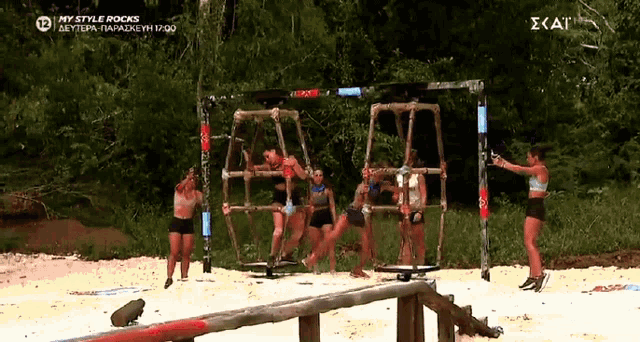 a group of women are playing a game called my style rocks on the beach