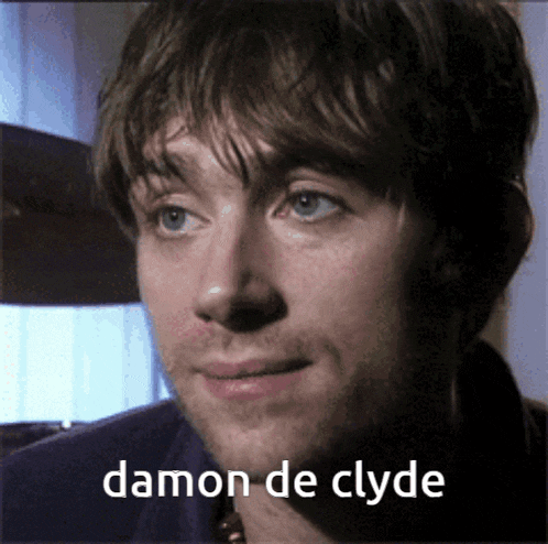 a close up of a man 's face with the words damon de clyde written below him
