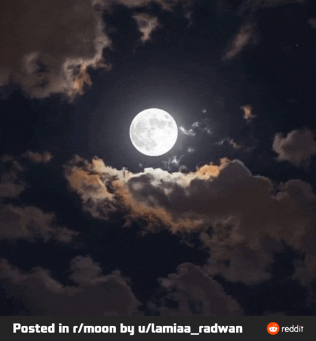 a full moon in a cloudy night sky is posted in r / moon by u / lamia_radwan