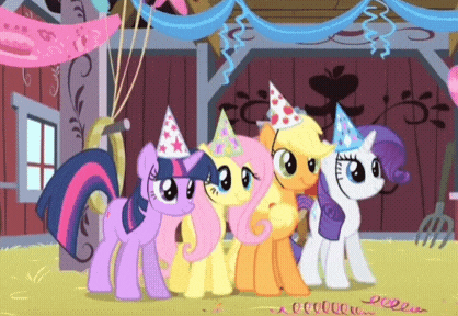 a group of ponies wearing party hats are standing next to each other in a barn
