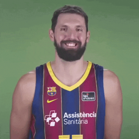 a man with a beard is wearing a basketball jersey with assistance sanitaria on it .