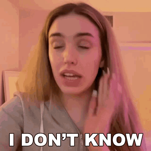 a woman is saying i don 't know with her eyes closed