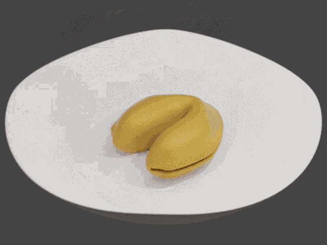 a gold fortune cookie with a card that says why are you at a buffet ul