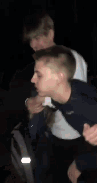 a blurry picture of a man 's face in the dark