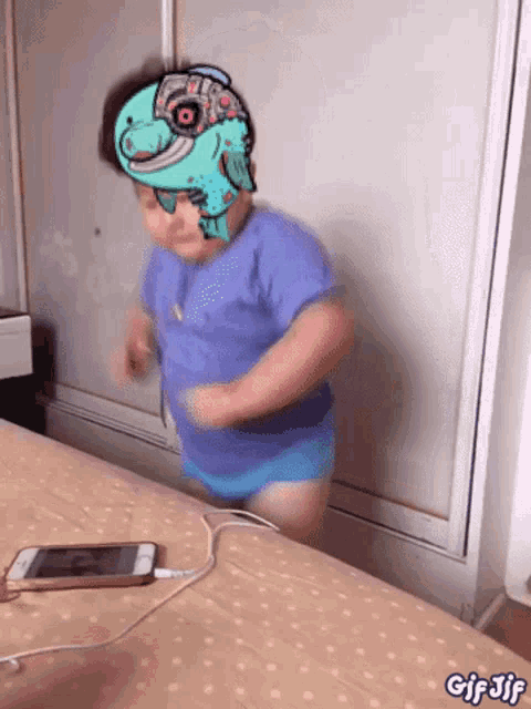 a gif of a child wearing headphones and a robot headband