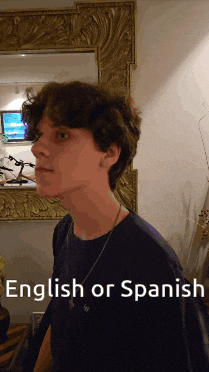 a young man stands in front of a mirror with the words english or spanish written below him