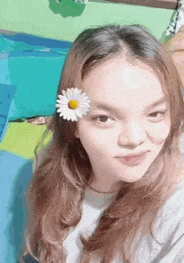 a woman with a daisy in her hair