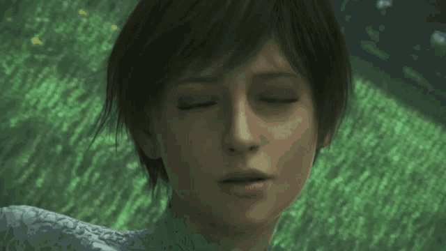 a woman with short hair is standing in a field of grass .