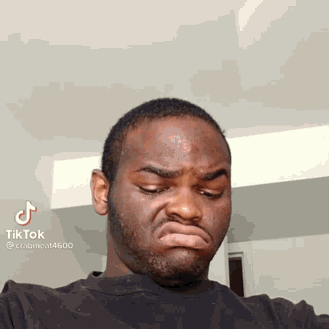 a man with a beard is making a funny face with a tiktok watermark on the bottom